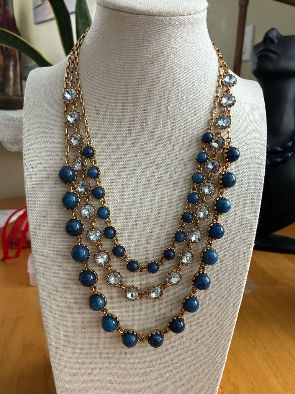 Three-Strand Gold Necklace with Navy Beads and Clear Crystals